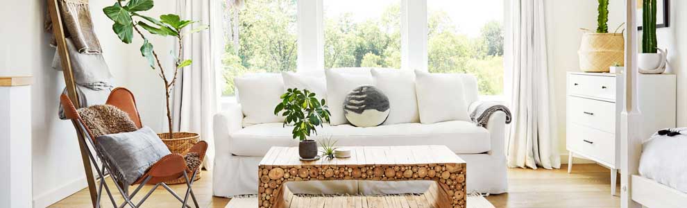 bright white living room at cottage with big windows