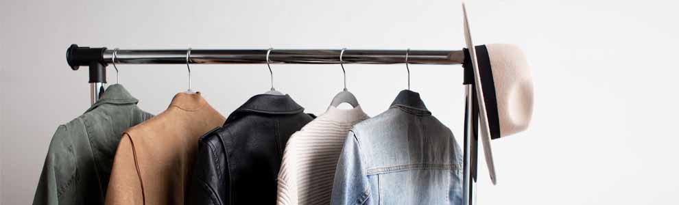 clothes hanging on minimalist clothes rack