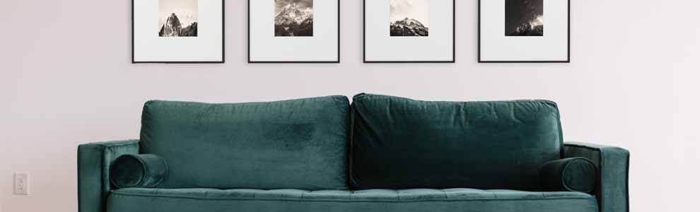 neatly aligned gallery wall with black and white photos