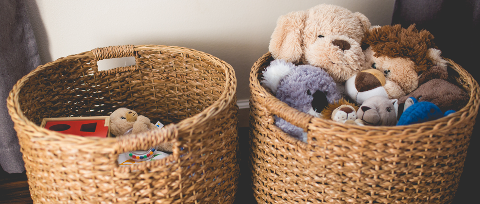 stuffed animals in two wicker baskets