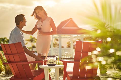 A couple enjoying the sunset on the beach in Naples, at Isles of Collier Preserve