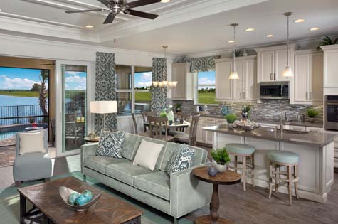 LakePark home interior includes open concept, many windows, and stainless steel appliances.